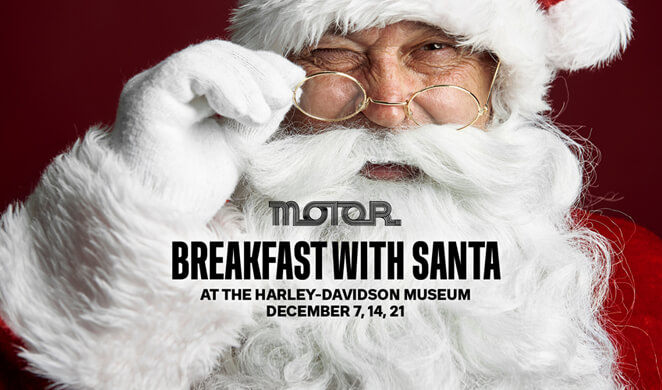 Santa with kid on motorcycle